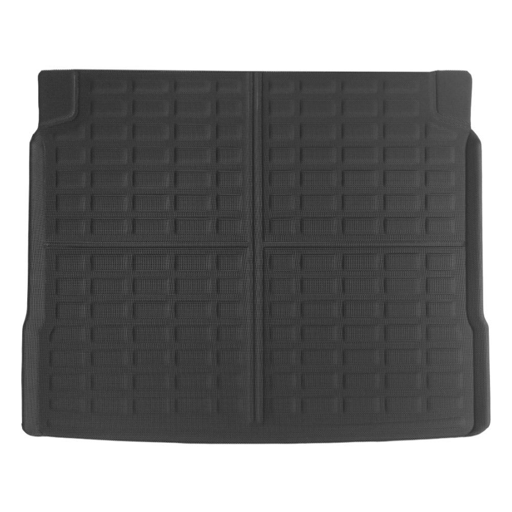 A black rubber car trunk liner with a grid-like textured pattern, shown flat against a white background.